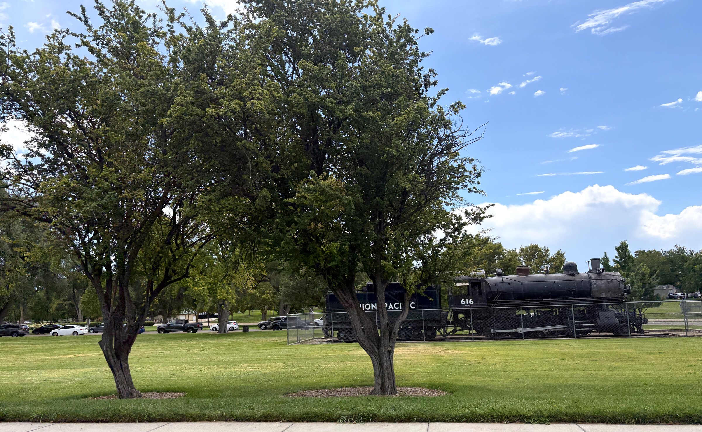 Union Pacific locomotive 616 on display among the shade trees at Lakeview Park in Nampa