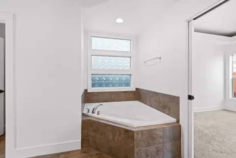 Soaking tub under the window