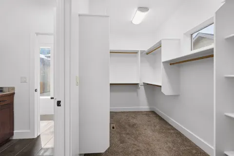 Walk-in closet off the primary bathroom