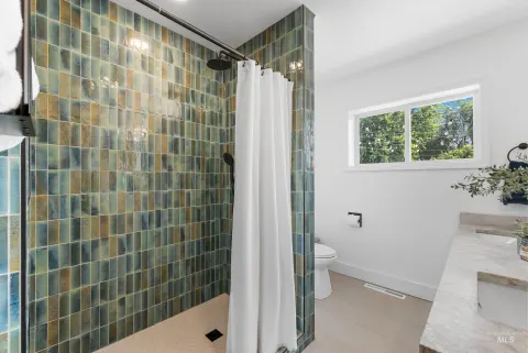 Green-tiled shower