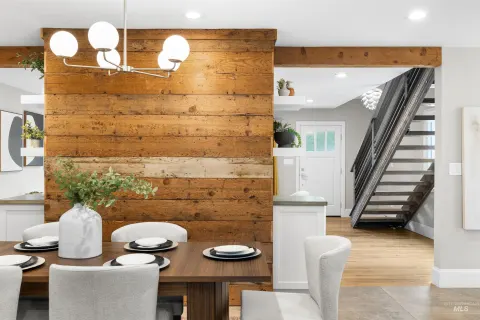 Dining nook under the wood wall, stairs to the bonus room